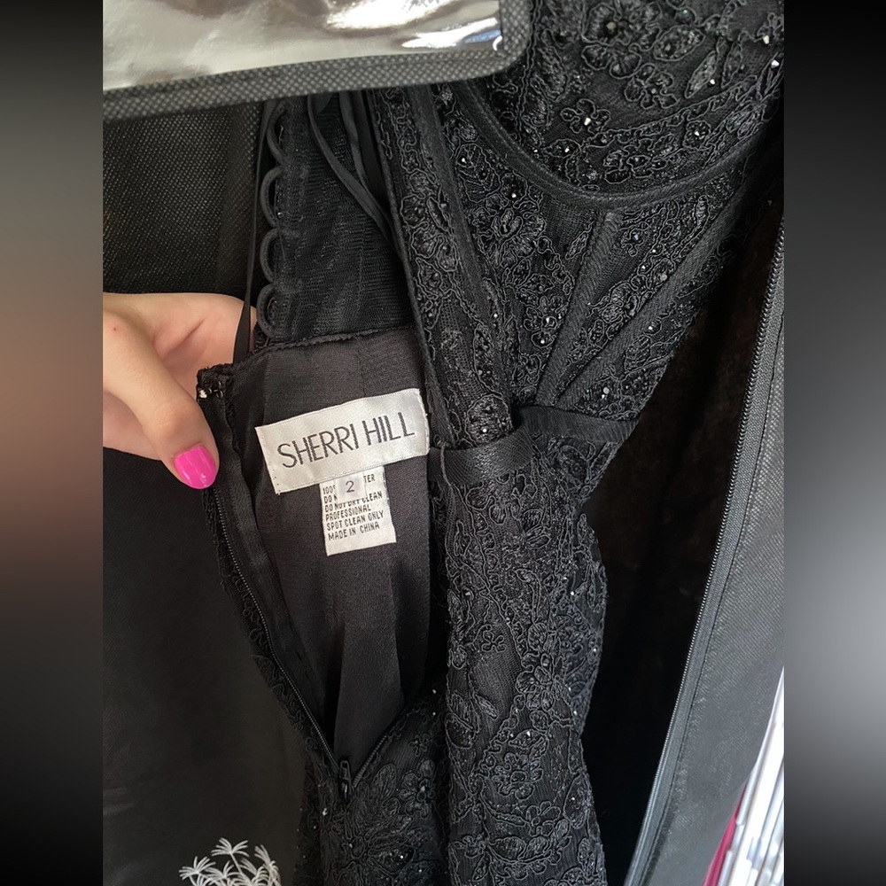 Worn once. Has detachable sleeves, Black, sparkly lace dress with a corset top.
